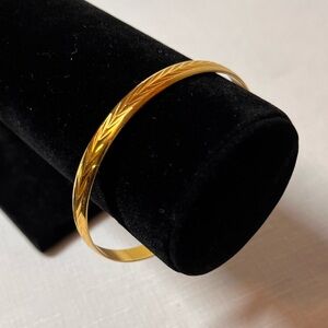 Fifth Avenue Gold tone Bangle Bracelet. Nickel and lead free. New.
